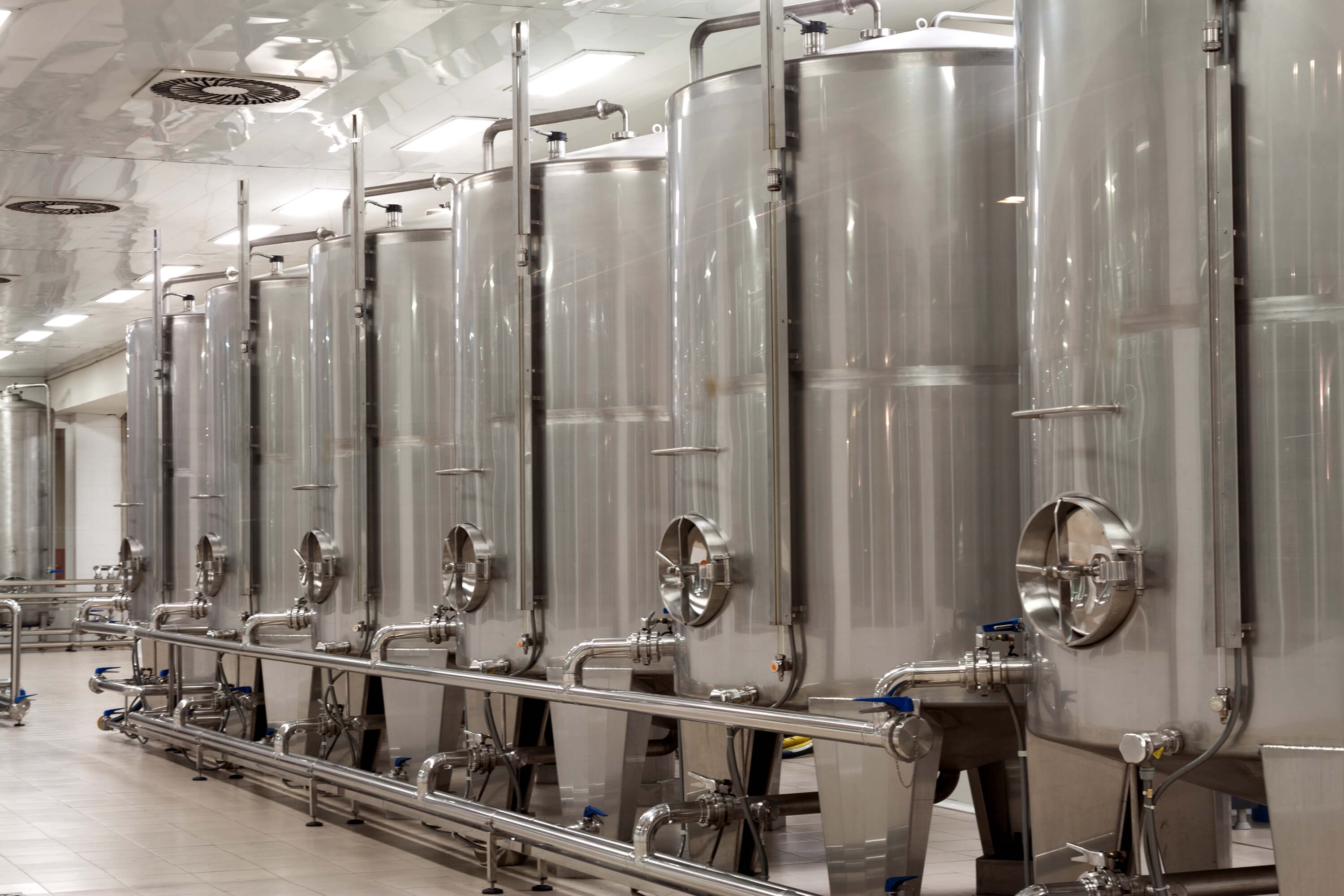 Giant fermentation tanks of engineered microorganisms can sustainably “brew” chemical products