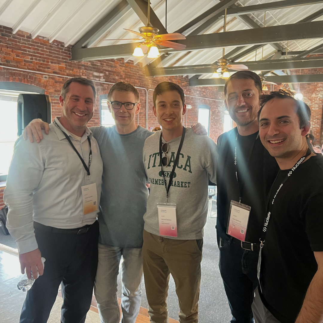 Colby Souders stands with an arm around co-panelists at the Nucleate Summit