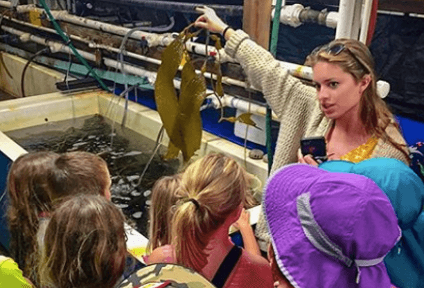 Kayla Wilson giving a tour of the Hubbs Aquarium at the Scripps Institute in San Diego
